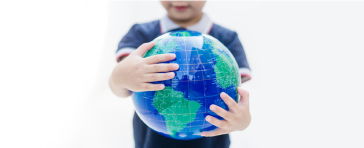 kid holding globe